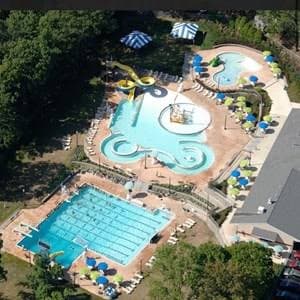 Aerial view of Menlo Aquatics Center: the leisure pool and lazy river, the splash structure, and the competition pool