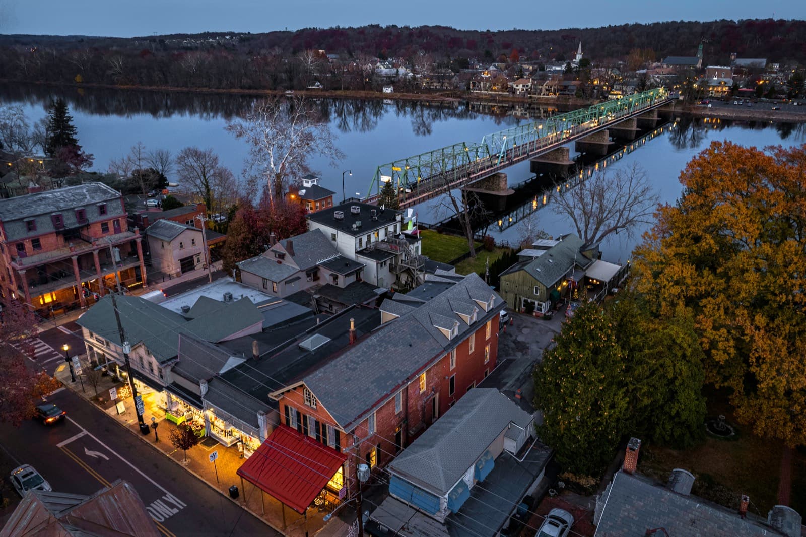 New Hope at dusk from above, with the bridge to Lambertville crossing the Delaware River