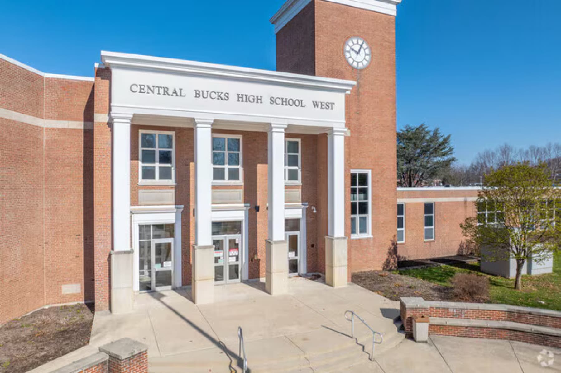 The columned entrance and clock tower of Central Bucks High School West in Doylestown, PA